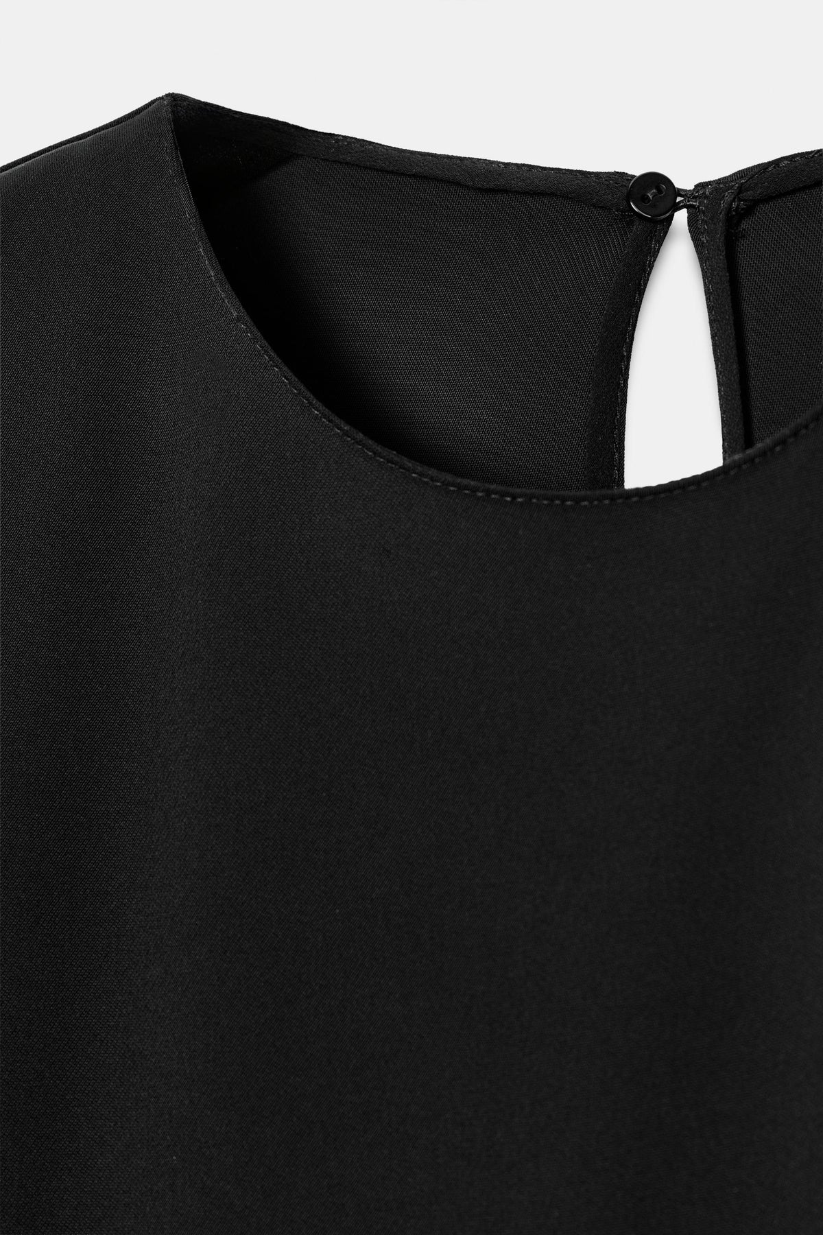 VESTIDO CORTO BAJO ASIMÉTRICO